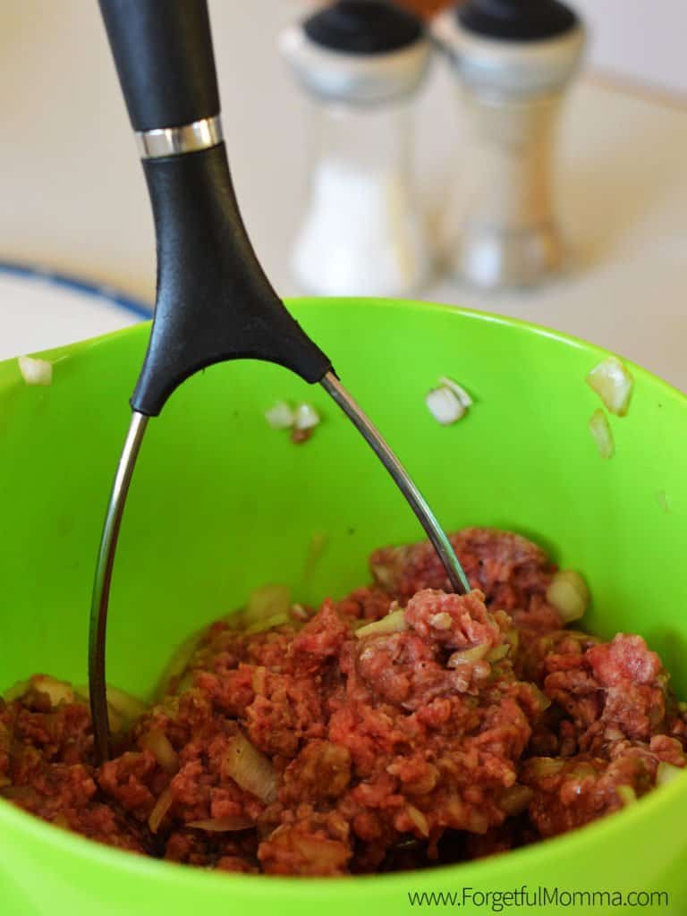 Mixing the meatloaf ingredients in a bowl