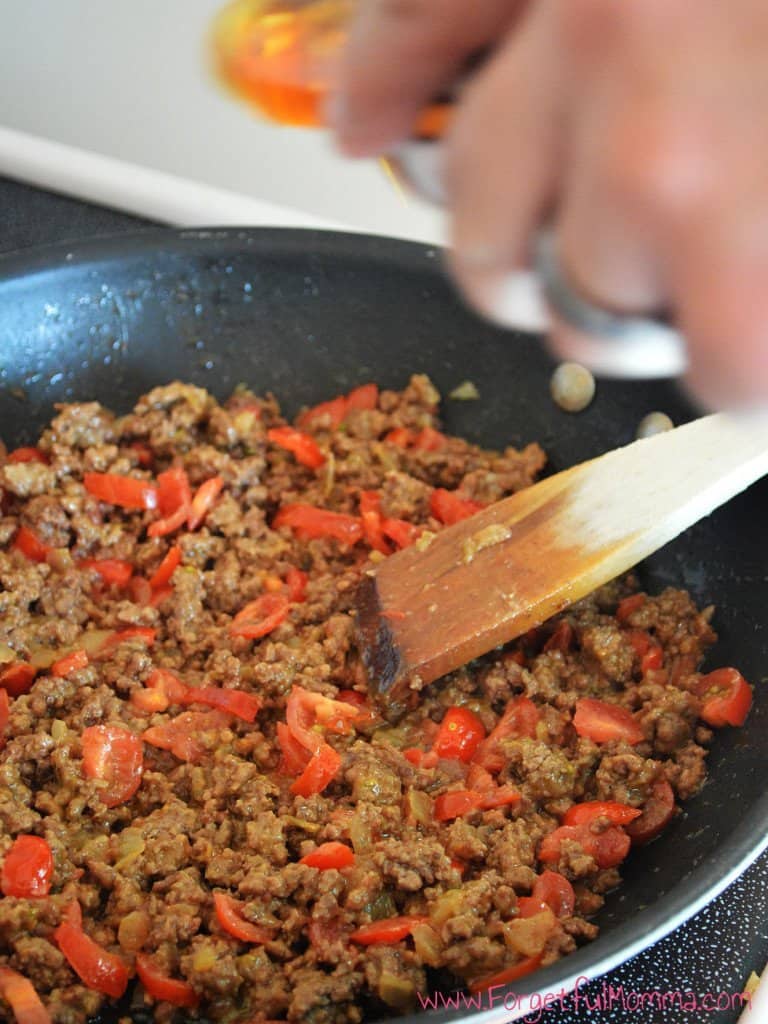 Adding diced tomatoes to Cheeseburger Casserole