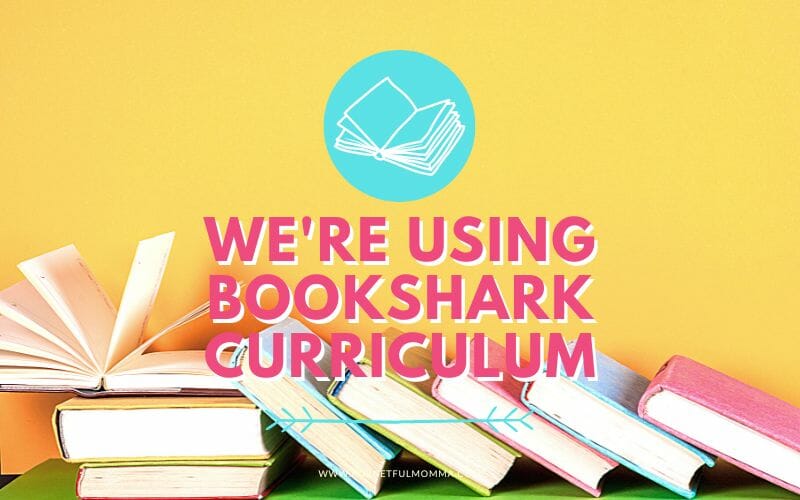 books laying on table with We're Using BookShark Curriculum text overlay