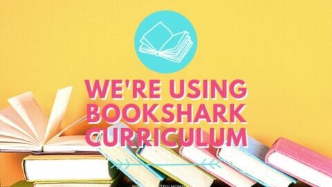 books laying on table with We're Using BookShark Curriculum text overlay