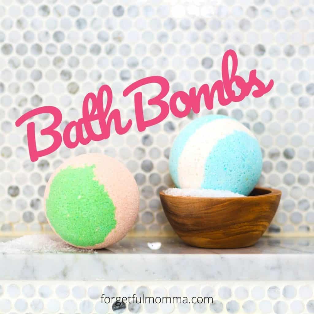 DIY bath bomb recipes - 2 bath bombs sitting on tub edge