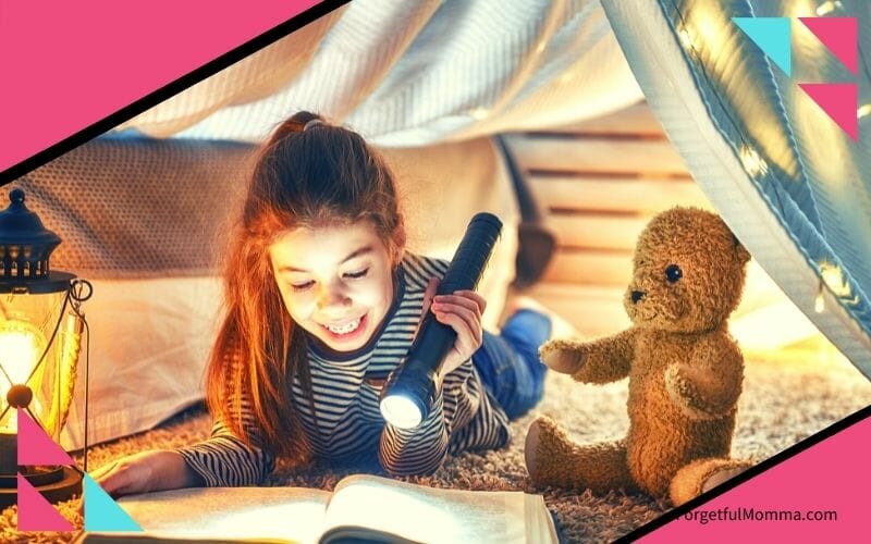 Book Recommendations for All Ages girl reading in a fort with a flashlight