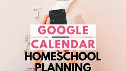 woman holding a phone with a calendar open on it