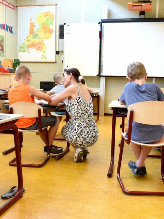 Children Sitting on Brown Chairs Inside the Classroom
