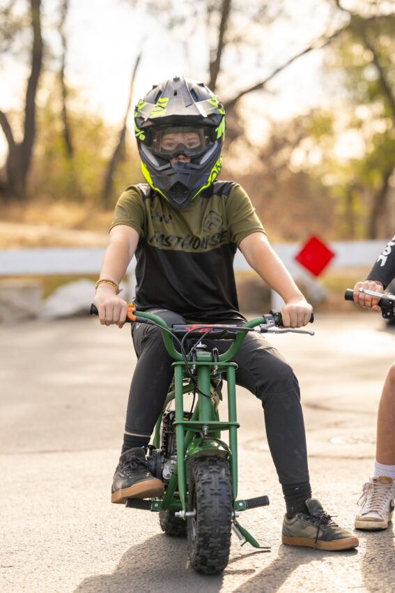 a person riding a green bike
