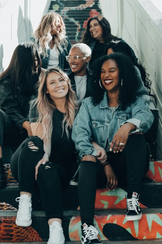 group of women laughing on stairs