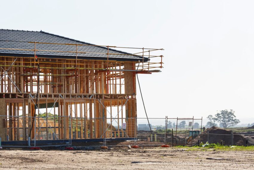 a house under construction with scaffolding around it
